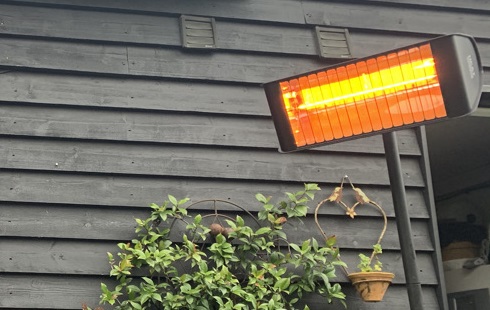 Fatboy Infrared heater on a tilt stand next to barn