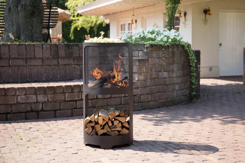 Fire Pit with wodostarage on a garden patio