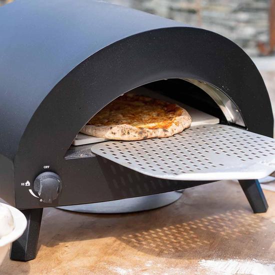 Omica Pizza Oven with pizza cooking